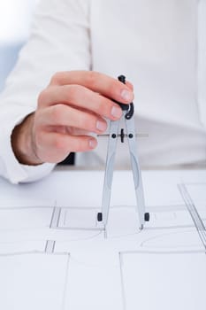 Close-up Of A Architect Drawing Plan On Blueprint