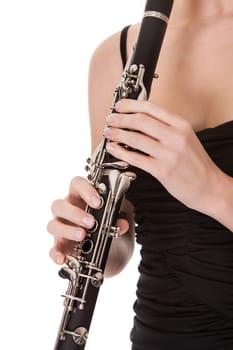 Beautiful young woman playing clarinet. Isolated on white