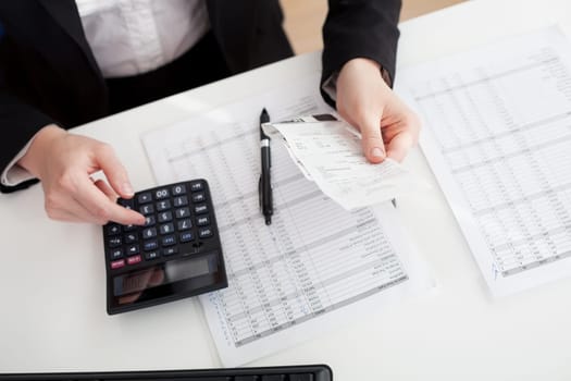 Cheerful accountant businesswoman working in the office