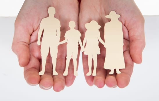 Close-up Of Male Hand Holding  Family Cutout Shape