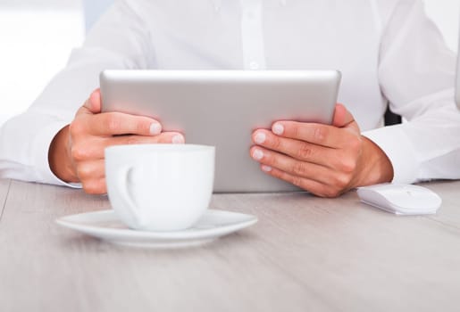 Close-up Of A Businessman Using Digital Tablet