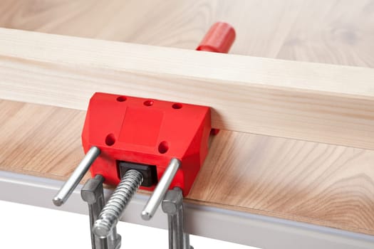 The red grip on the wooden table