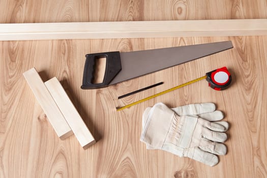 Photo of carpenter tools and building plan