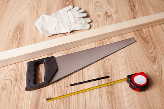 Photo of carpenter tools and building plan