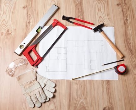 Photo of carpenter tools and building plan