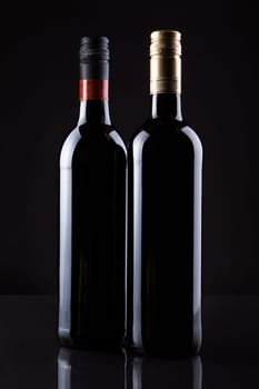Two Bottles Of Wine Isolated On Black Background