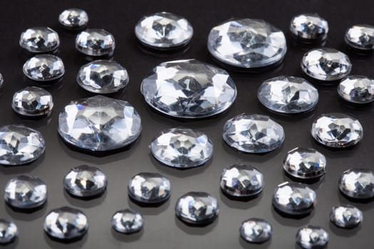 Close-up Of Diamonds Isolated Over Gray Background