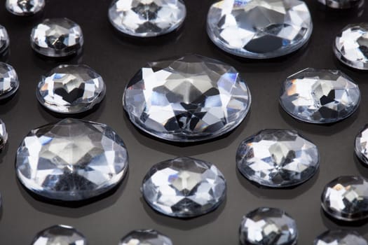 Close-up Of Diamonds Isolated Over Gray Background