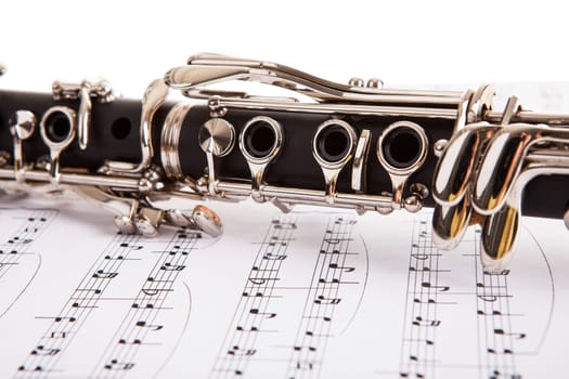 Close-up Of Clarinet And Musical Notes Isolated On White Background