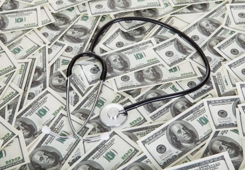 Photos of stethoscope and american dollar notes