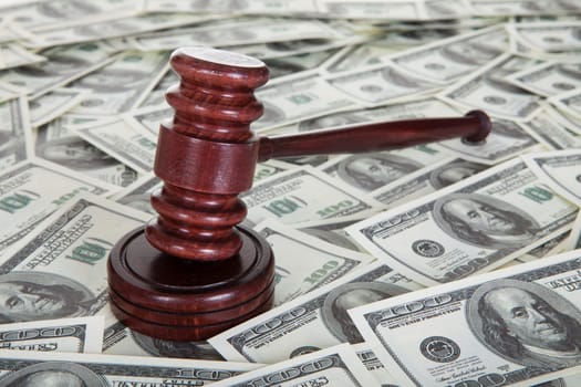 Judge gavel and dollar bills. Corruption concept