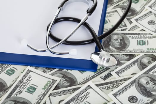 Photos of stethoscope and american dollar notes