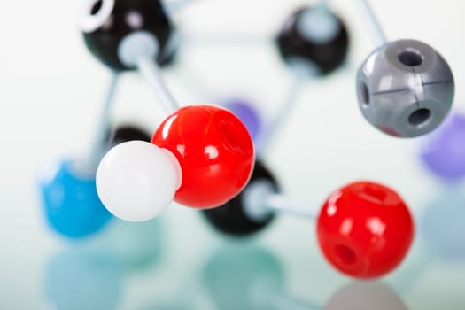 Model of molecular structure on green reflective background