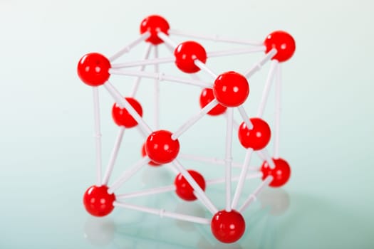 Model of copper molecular structure on green reflective background
