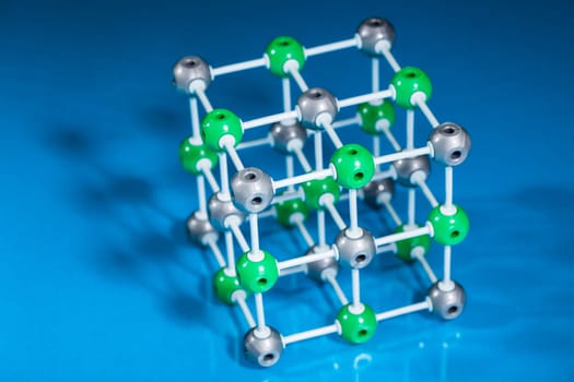 Model of molecular structure on blue reflective background