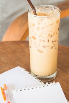 Ice coffee latte on wooden table, stock photo