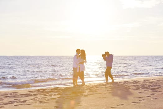 happy young romantic couple in love have fun on beautiful beach at beautiful summer day