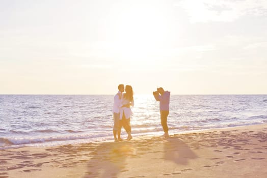 happy young romantic couple in love have fun on beautiful beach at beautiful summer day