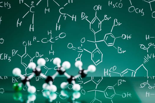 Model of molecular structure on green reflective background