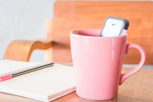 Creative work table with notepaper and mobile phone, stock photo