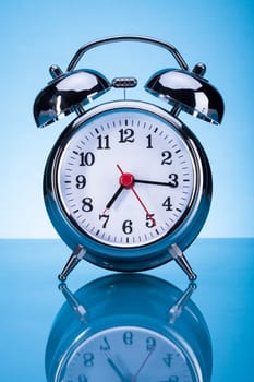 Photo Of Alarm Clock Over Blue Background