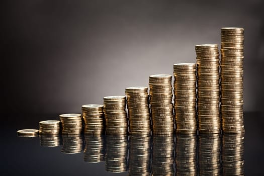 Stack Of One Euro Coins Over Black Background