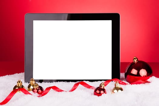 Blank Digital Tablet With Christmas Baubles On Red Background