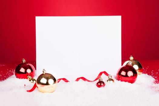 Blank Placard With Christmas Baubles On Red Background