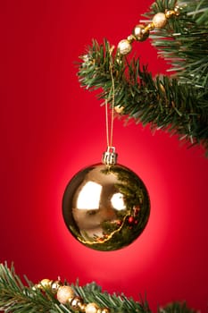 Close-up Of Yellow Decorative Bauble Hanged On Christmas Tree