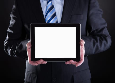 Mature Businessman Showing Digital Tablet Over Black Background