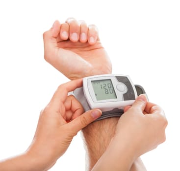 Close-up Of Female Doctor Checking Patient's Blood Pressure