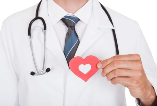 Close-up Of Doctor Holding Heart Shape Symbol
