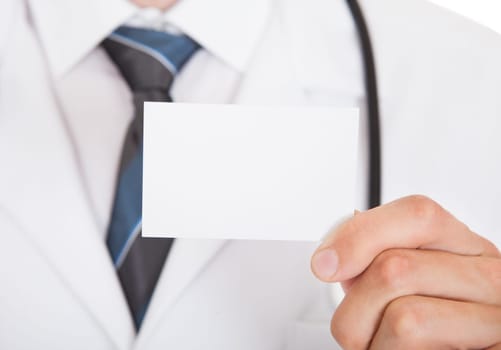 Closeup photo of doctor hand showing empty visiting card