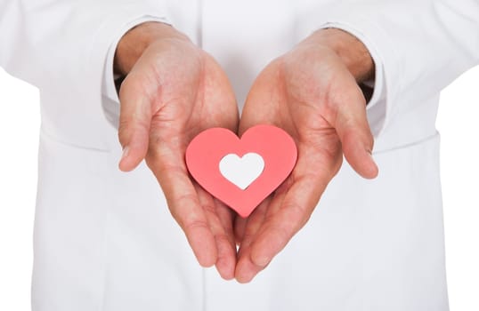 Close-up Of Doctor Holding Heart Shape Symbol