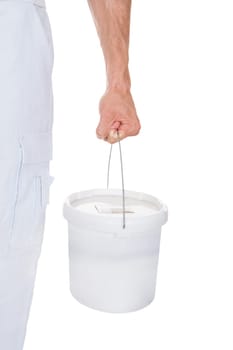 Close-up Of A Painter Holding Bucket Over White Background
