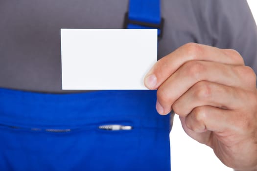 Portrait Of Happy Mechanic In Workwear Holding Visiting Card