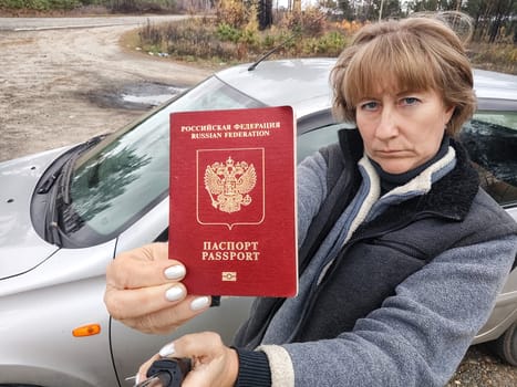 Driver girl with Russian passport and car. Russian cars banned for entering in Europe. Russian tourism closed during war of Russia and Uk. Confiscation of Russian car and sanctions against Russians