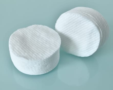 Stack of Cotton disks on a light blue background