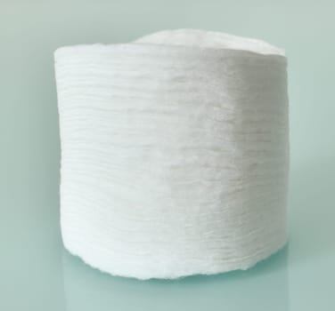 Stack of Cotton disks on a light blue background