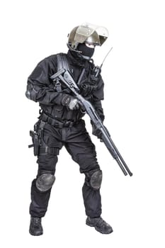 Spec ops soldier in black uniform and face mask with shotgun