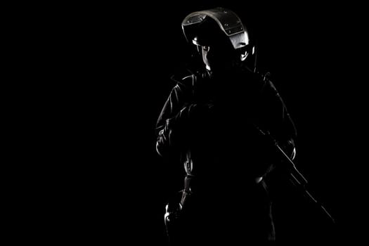 Contour shot of spec ops soldier on black background