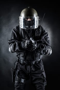 Spec ops soldier in uniform on black background
