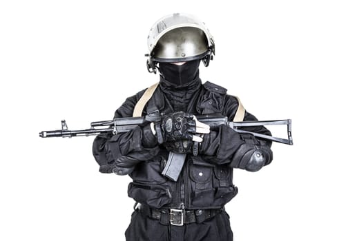 Spec ops soldier in black uniform and face mask with his rifle