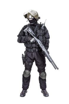 Spec ops soldier in black uniform and face mask with shotgun