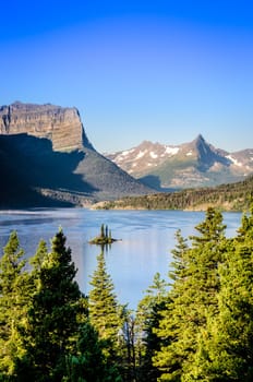 Vertical andscape view of mountain range and lake in Glacier NP, Montana, USA