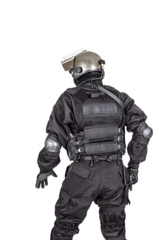 Spec ops soldier in black uniform and face mask shot from behind