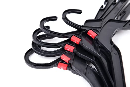 black plastic clothes hanger on white background