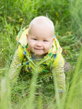 Adorable baby on green grass