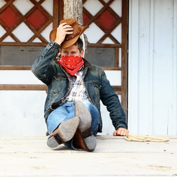 SOUTH WEST - A cowboy takes time to rest and reflect.