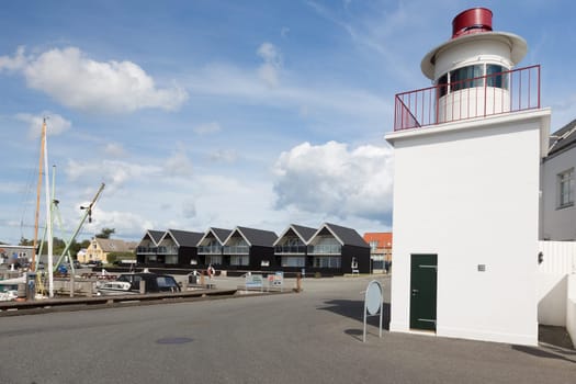 Small lighthouse in the harbour of the small town of Lohals on Langeland